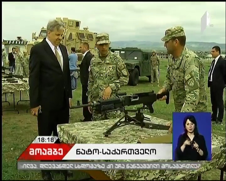 Levan Izoria and Ian Kelly attend demonstration of U.S.-produced rifle in Krtsanisi