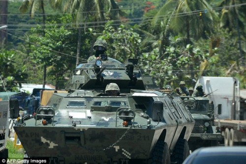 Isis-linked militants storm school and take hostages in Philippines